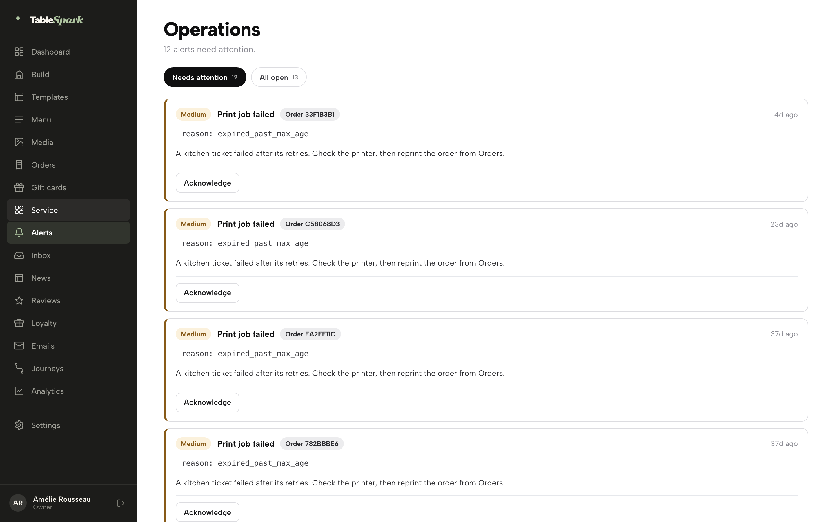 The Operations (Alerts) page: Needs attention and All open tabs with counts, and a list of Print job failed alert cards each with a Medium severity chip, an order reference, a plain-English explanation, and an Acknowledge button